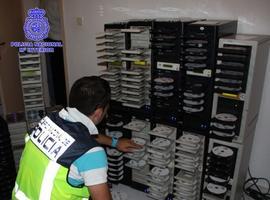 La Policía Nacional desmantela un centro de producción a gran escala de obras audiovisuales "piratas"